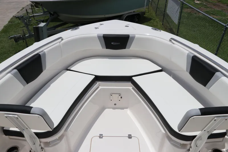 Slide: The Image of 2024 Robalo R230 Center Console boat with spacious seating area and sleek design. - 26