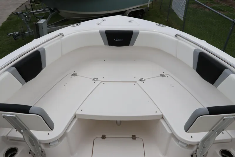 Slide: The Image of 2024 Robalo R230 Center Console boat with spacious seating and sleek design. - 29