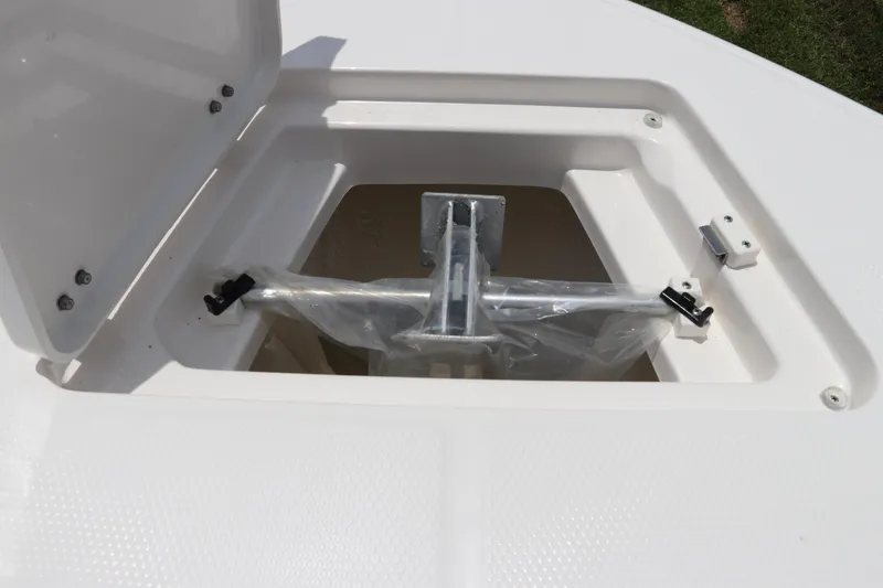 Slide: The Image of 2024 Robalo R230 Center Console anchor storage compartment with open lid. - 35