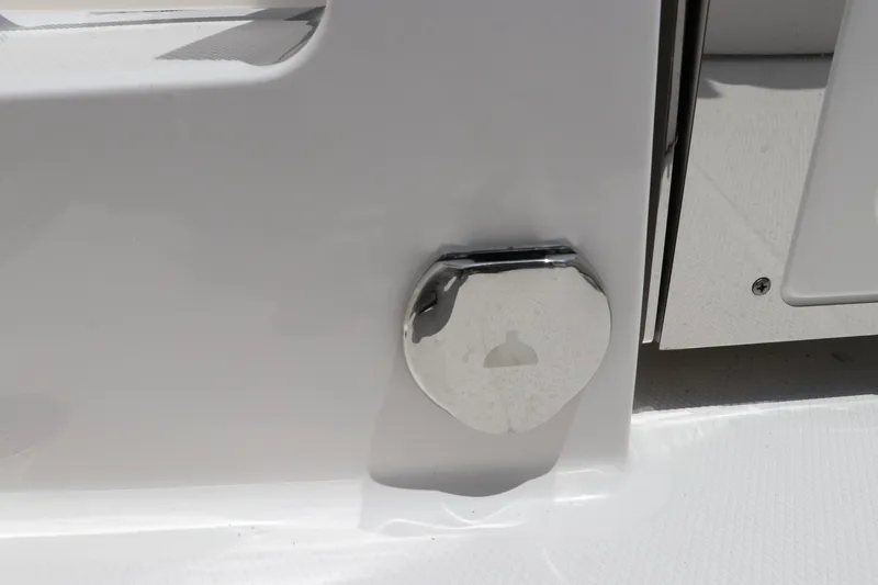 Slide: The Image of 2024 Robalo R230 Center Console boat detail with chrome hardware. - 6