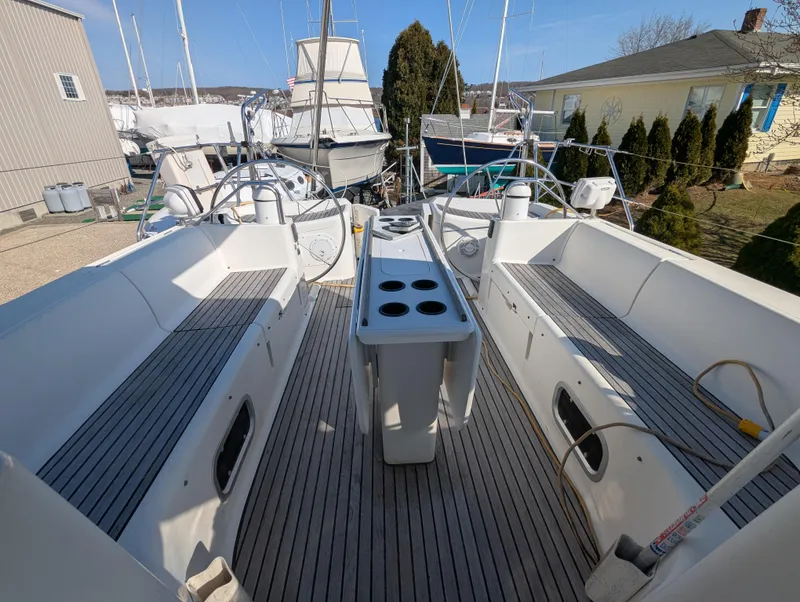 Slide: The Image of Cockpit of 1996 Jeanneau 45.1 sailboat with seating and central console. - 11