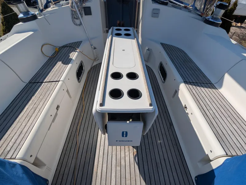 Slide: The Image of Cockpit of 1996 Jeanneau 45.1 sailboat with seating and cup holders. - 12