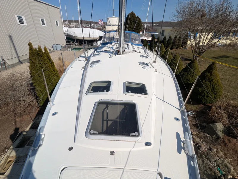 Slide: The Image of Sailboat Jeanneau 45.1, 1996 model, docked outdoors with clear deck view. - 17