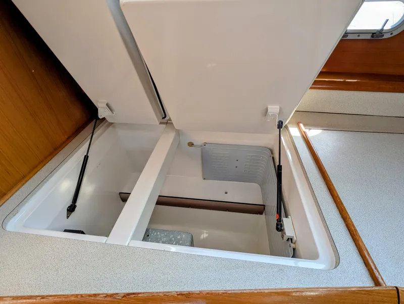 Slide: The Image of Open storage compartments on a 1996 Jeanneau 45.1 yacht interior. - 27
