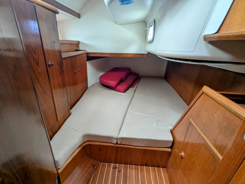 Slide: The Image of Cozy cabin interior of 1996 Jeanneau 45.1 sailboat with wooden furnishings and bedding. - 37