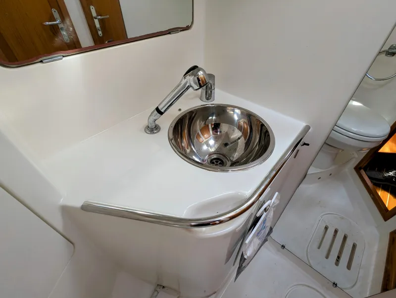 Slide: The Image of 1996 Jeanneau 45.1 yacht bathroom with stainless steel sink and modern fixtures. - 39