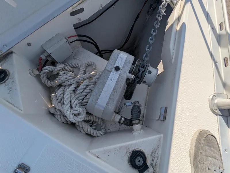 Slide: The Image of Anchor locker of 1996 Jeanneau 45.1 sailboat with rope and chain. - 41