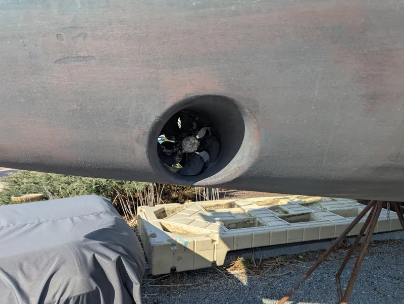 Slide: The Image of Hull of 1996 Jeanneau 45.1 sailboat with visible bow thruster. - 42