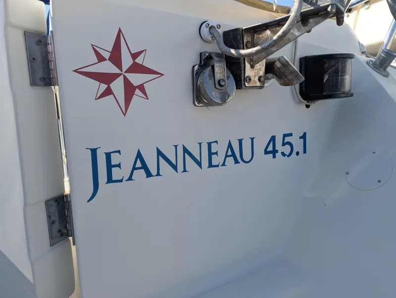 Slide: The Image of Jeanneau 45.1 sailboat, 1996 model, with star emblem and hardware details. - 6