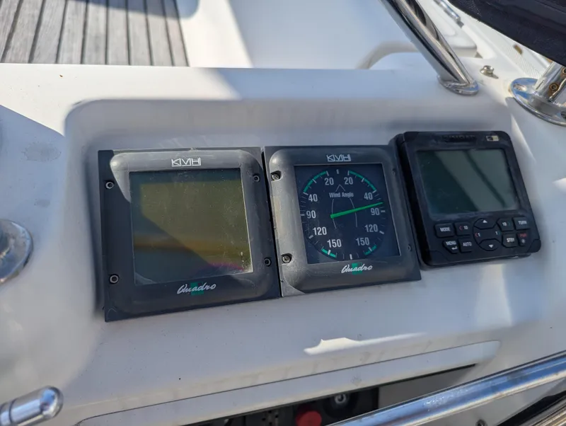Slide: The Image of Control panel of a 1996 Jeanneau 45.1 sailboat with navigation instruments. - 9