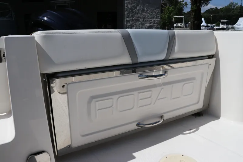 Slide: The Image of 2024 Robalo R230 Center Console boat seat and storage compartment. - 11