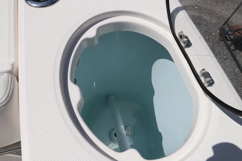 Slide: The Image of Livewell of 2024 Robalo R230 Center Console boat, open and empty. - 14