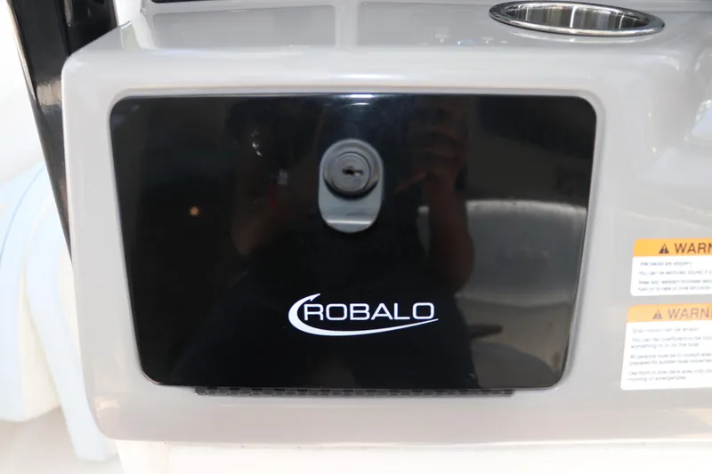 Slide: The Image of 2024 Robalo R230 Center Console dashboard with logo and warning labels. - 20
