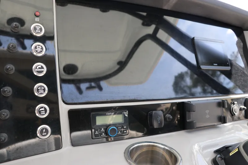 Slide: The Image of 2024 Robalo R230 Center Console dashboard with control panel and electronic display. - 25
