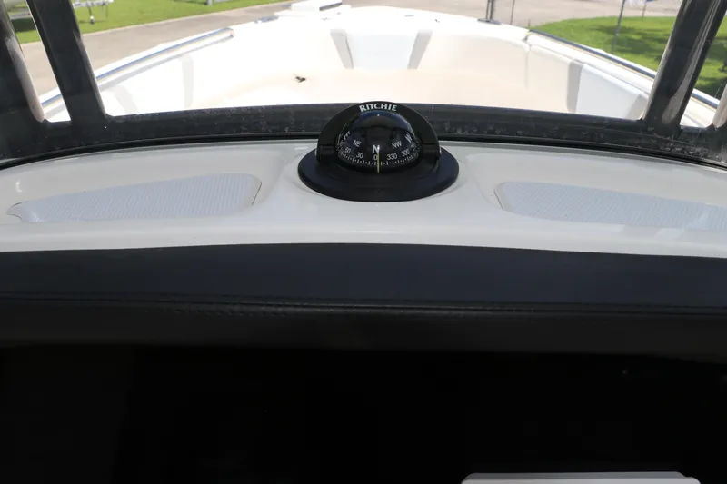 Slide: The Image of 2024 Robalo R230 Center Console boat compass view. - 26