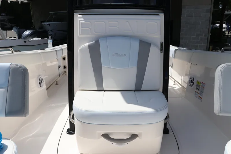 Slide: The Image of 2024 Robalo R230 Center Console boat seat with white and gray upholstery. - 29