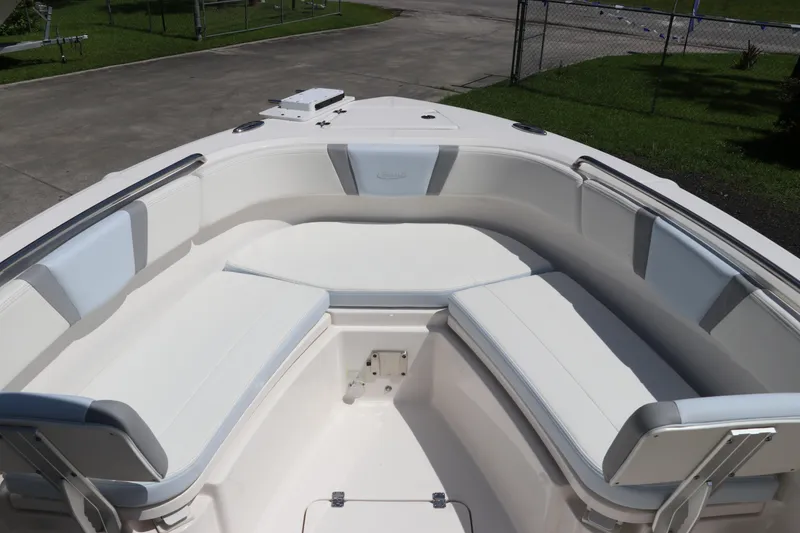 Slide: The Image of 2024 Robalo R230 Center Console boat with spacious seating area. - 31