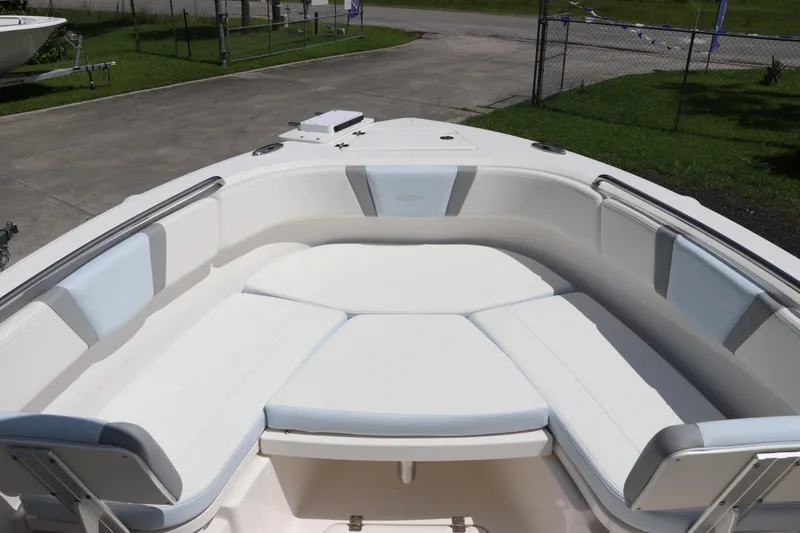 Slide: The Image of 2024 Robalo R230 Center Console boat with spacious seating area and sleek design. - 32