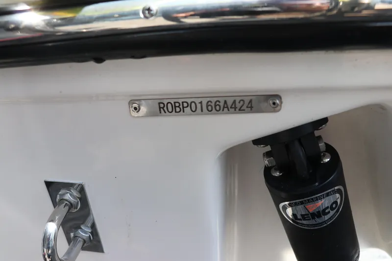 Slide: The Image of 2024 Robalo R230 Center Console boat identification plate and Lenco marine equipment. - 43