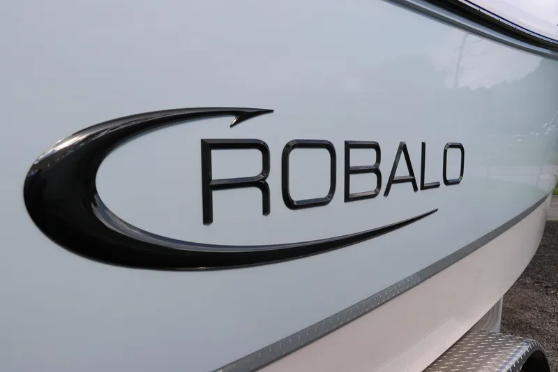 Slide: The Image of 2024 Robalo R230 Center Console boat logo on hull. - 6