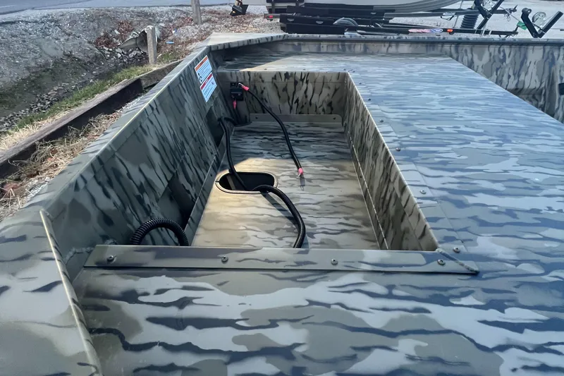 Slide: The Image of 2025 SeaArk 1648 MV Special boat interior with camouflage design and wiring details. - 3