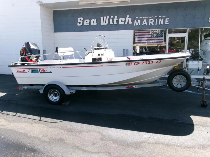 Slide: The Image of 2003 Boston Whaler 170 Montauk boat on trailer outside Sea Witch Marine. - 0