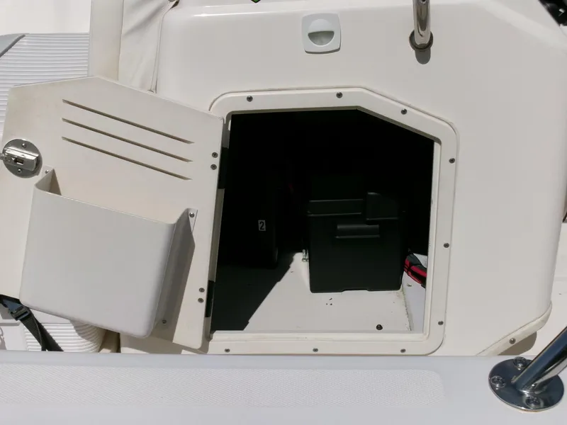 Slide: The Image of Open storage compartment on a 2003 Boston Whaler 170 Montauk boat. - 12
