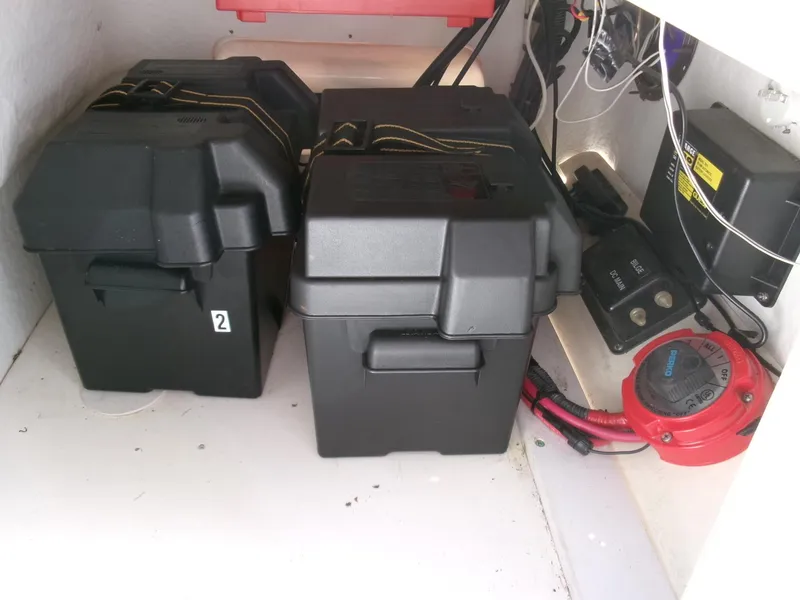 Slide: The Image of Battery compartment of a 2003 Boston Whaler 170 Montauk boat with electrical components. - 13