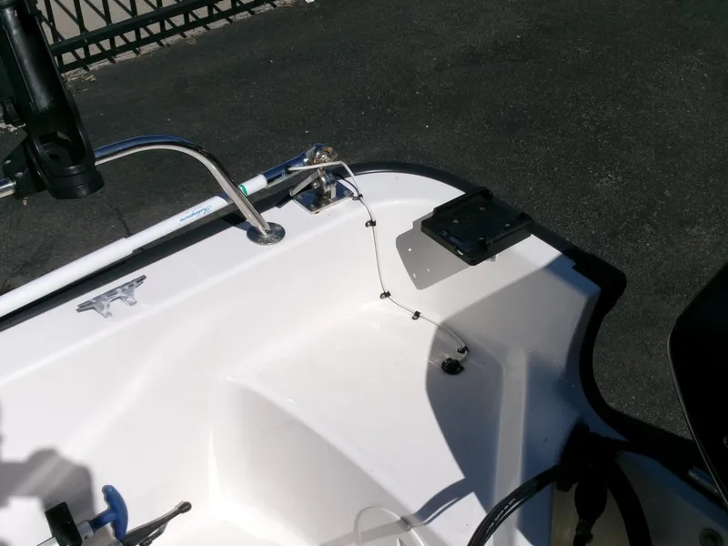 Slide: The Image of 2003 Boston Whaler 170 Montauk boat interior with fishing rod holder and equipment. - 17