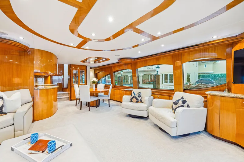 Slide: The Image of Luxurious interior of 2005 Hatteras 80 Motor Yacht with elegant wood finishes and plush seating. - 25
