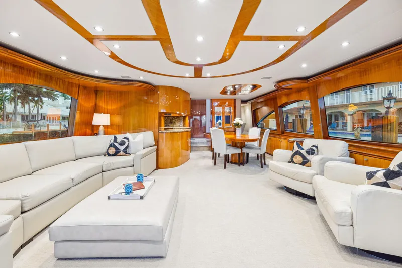 Slide: The Image of Luxurious interior of 2005 Hatteras 80 Motor Yacht with elegant seating and dining area. - 26