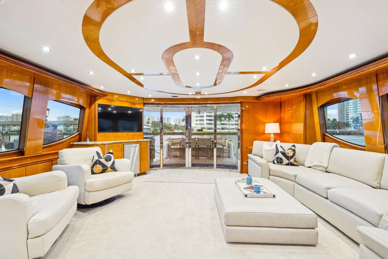 Slide: The Image of Luxurious interior of 2005 Hatteras 80 Motor Yacht with elegant seating and modern decor. - 30