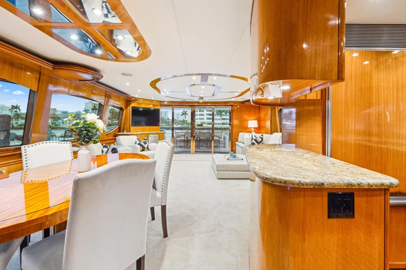 Slide: The Image of Luxurious interior of 2005 Hatteras 80 Motor Yacht with elegant dining and lounge area. - 36