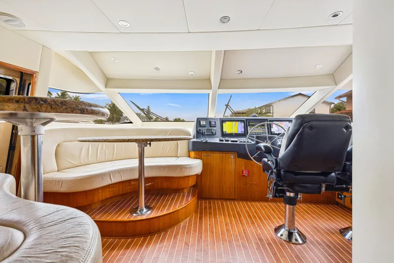 Slide: The Image of Interior of 2005 Hatteras 80 Motor Yacht with helm and seating area. - 41