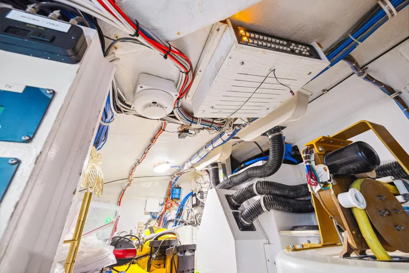 Slide: The Image of Engine room of 2005 Hatteras 80 Motor Yacht with wiring and equipment. - 45