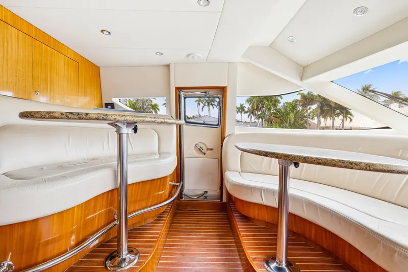 Slide: The Image of Luxurious interior of 2005 Hatteras 80 Motor Yacht with elegant seating and wood flooring. - 46