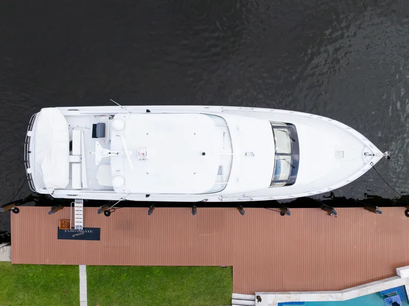 Slide: The Image of Aerial view of 2005 Hatteras 80 Motor Yacht docked by wooden pier. - 7