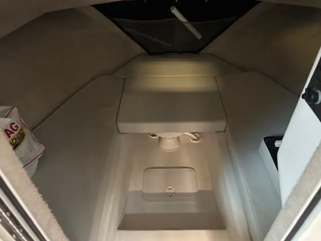 Slide: The Image of 2022 Parker 2520 XLD Sport Cabin interior with cushioned seating and storage. - 13