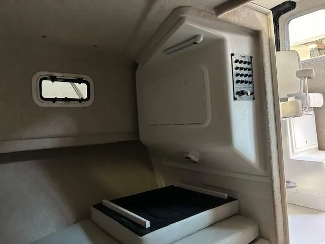 Slide: The Image of 2022 Parker 2520 XLD Sport Cabin interior with seating and control panel. - 16