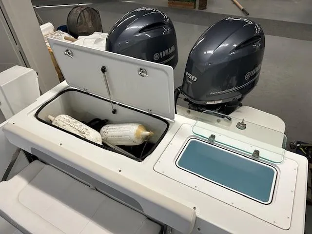 Slide: The Image of 2022 Parker 2520 XLD Sport Cabin with Yamaha outboard motors and storage compartment. - 18