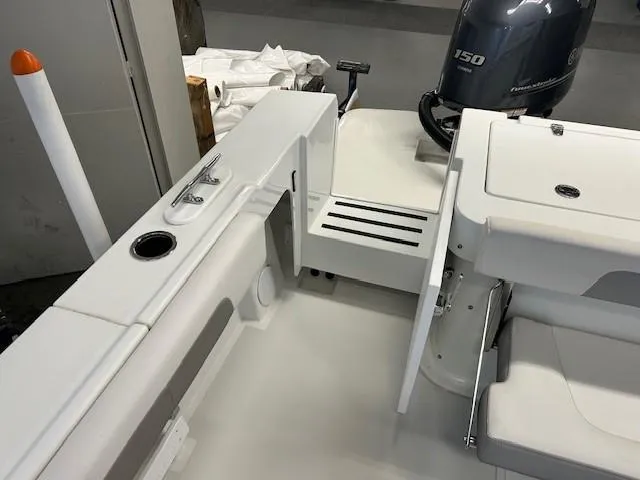 Slide: The Image of 2022 Parker 2520 XLD Sport Cabin boat interior with Yamaha 150 engine. - 19