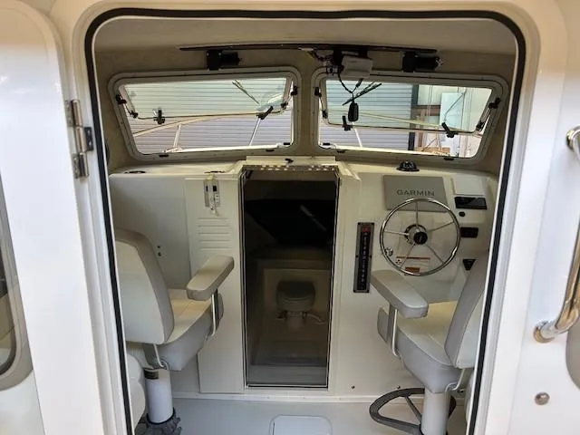 Slide: The Image of 2022 Parker 2520 XLD Sport Cabin interior with steering wheel and seating. - 7