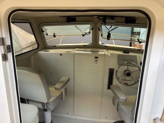 Slide: The Image of 2022 Parker 2520 XLD Sport Cabin interior with steering wheel and seating. - 8