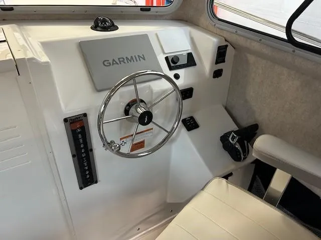 Slide: The Image of Interior of 2022 Parker 2520 XLD Sport Cabin with Garmin navigation system. - 9