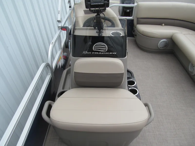 Slide: The Image of 2023 Sun Tracker Bass Buggy 16 XL Select interior with beige seating and steering console. - 10