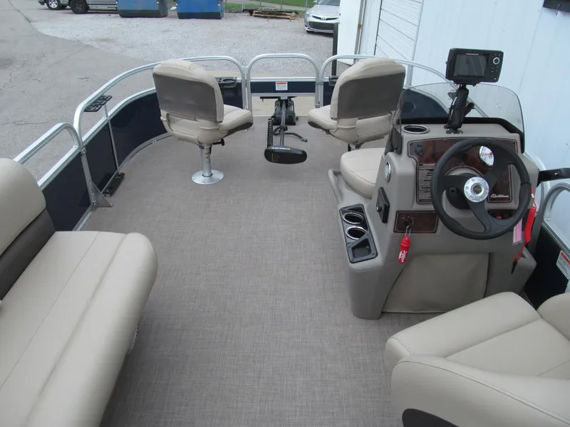 Slide: The Image of 2023 Sun Tracker Bass Buggy 16 XL Select pontoon boat interior with seating and steering console. - 5