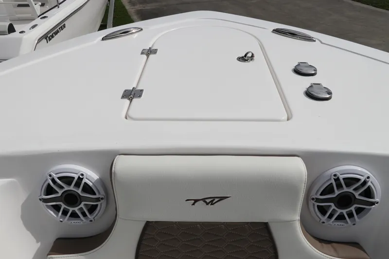 Slide: The Image of 2024 Tidewater 232 CC Adventure boat deck with speakers and storage hatch. - 19