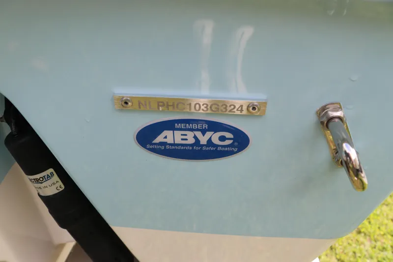 Slide: The Image of 2024 Tidewater 232 CC Adventure boat with ABYC member sticker and serial number. - 20