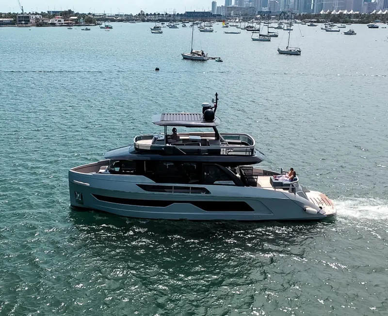 Slide: The Image of Luxury Explorer 62 yacht cruising in a scenic bay, 2021 model. - 0