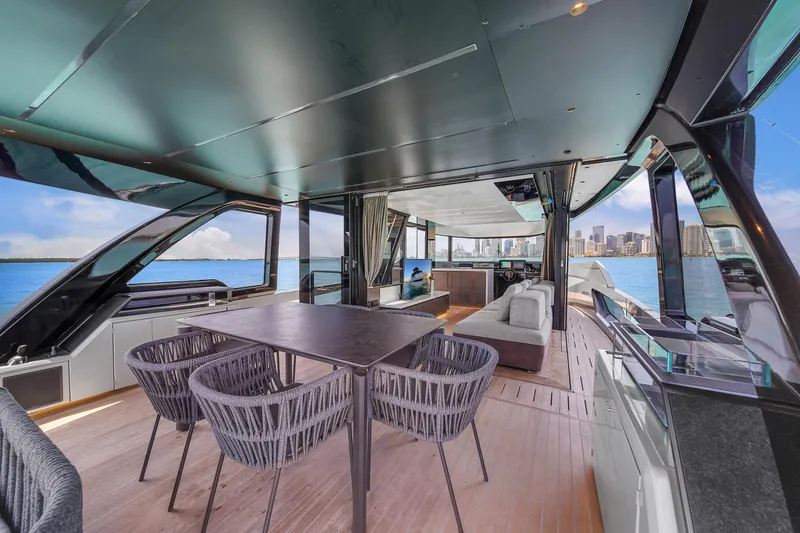 Slide: The Image of Luxurious 2021 Explorer 62 yacht interior with modern dining area and ocean view. - 12